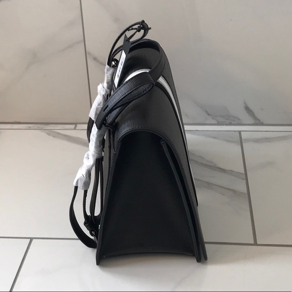 is the mini kavu backpack waterproof Rope Sling , Raven cat call or getting lost in Color:BOGCORE CAMO A1C Haunted Mansion and Dracula